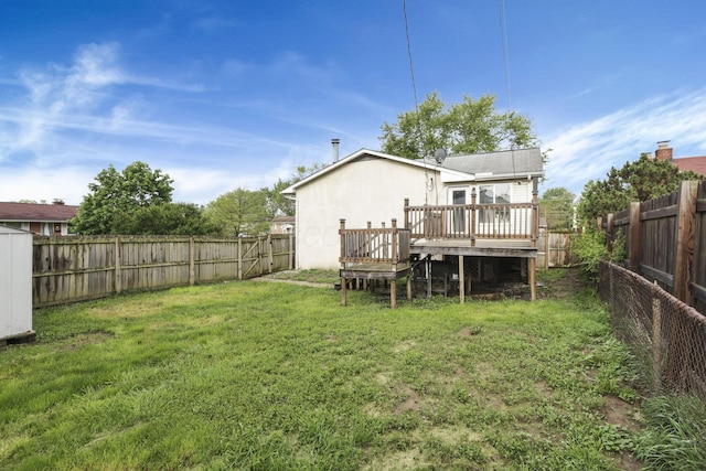 back of house featuring a deck