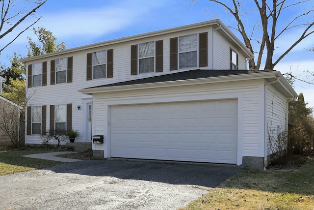 view of front of house with a garage and driveway