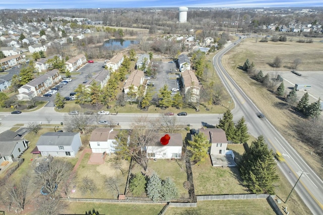 aerial view with a residential view and a water view