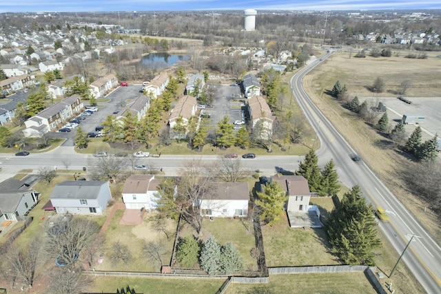 drone / aerial view with a residential view and a water view