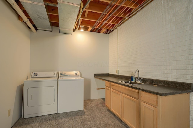 laundry room featuring a sink, cabinet space, and washing machine and clothes dryer