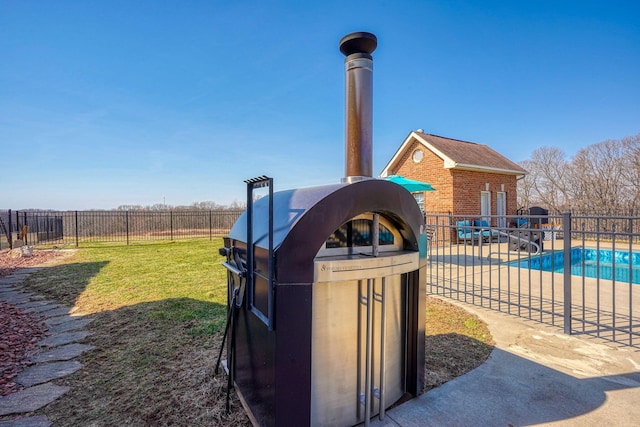 exterior details with a pool and fence