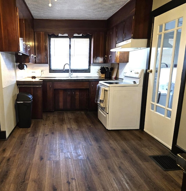 kitchen with under cabinet range hood, a textured ceiling, dark wood finished floors, and white range with electric cooktop