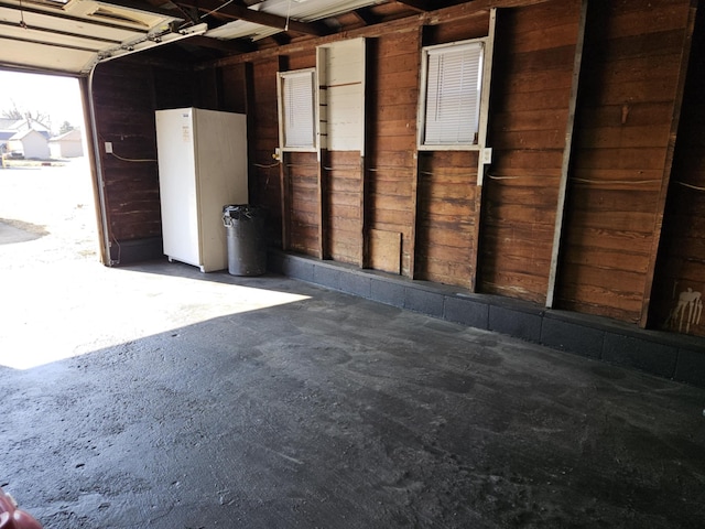 garage with freestanding refrigerator