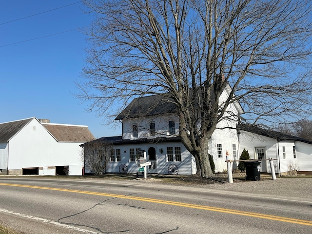 view of front facade featuring a chimney