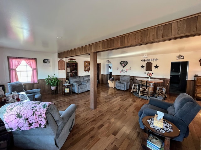 living room featuring wood walls and wood finished floors