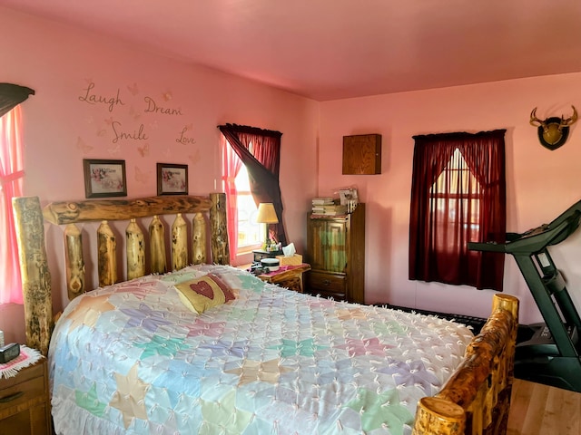 bedroom with wood finished floors