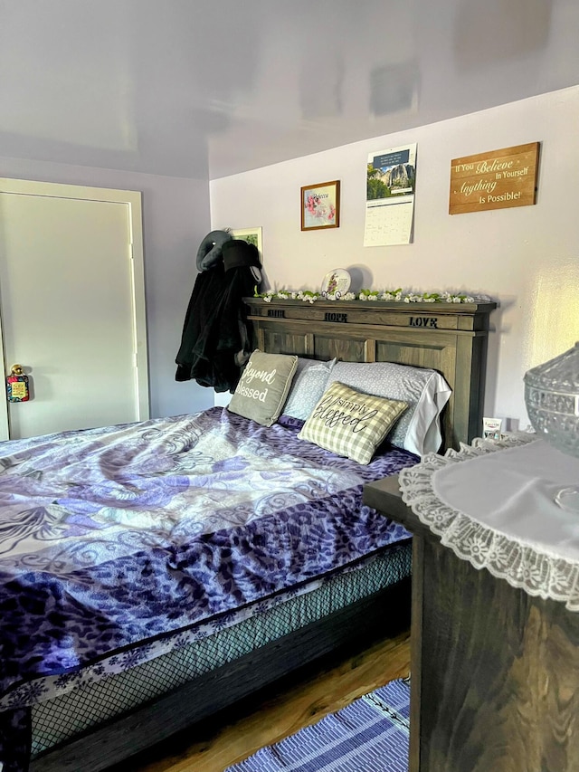 bedroom featuring wood finished floors