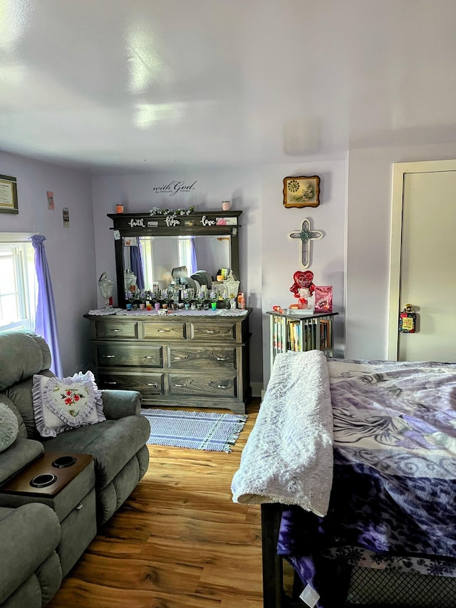 bedroom with wood finished floors