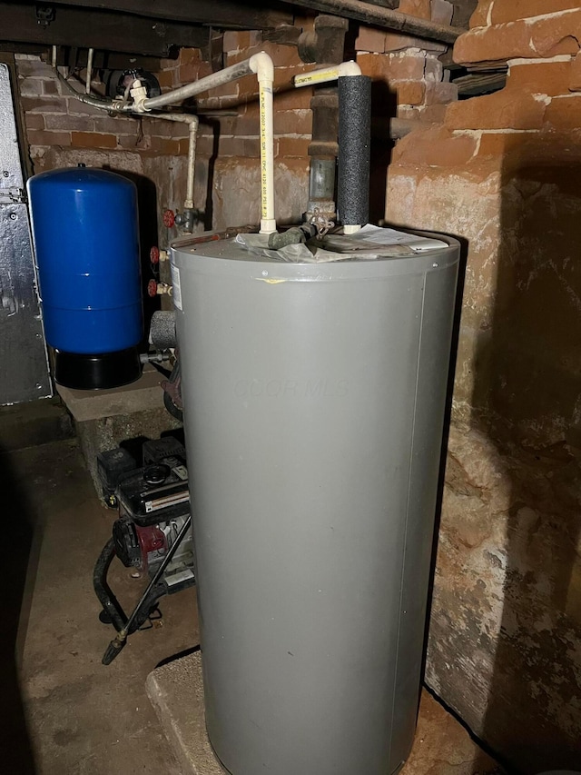 utility room featuring water heater