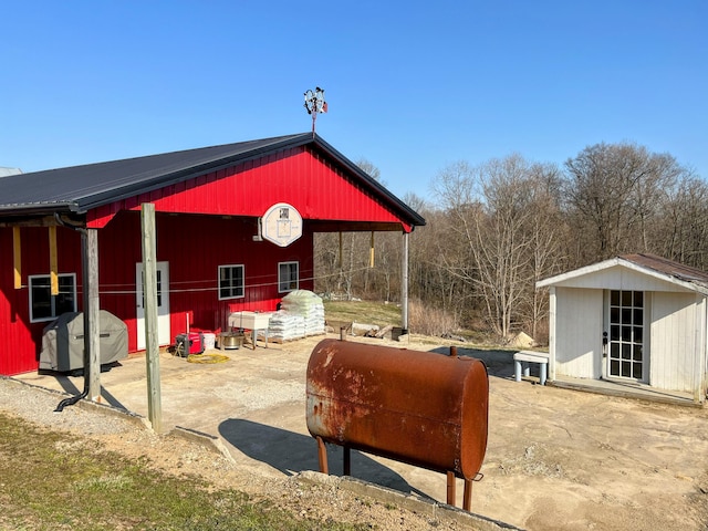 view of patio / terrace featuring an outbuilding and an exterior structure