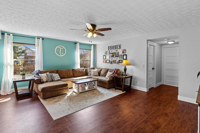 living room featuring baseboards, plenty of natural light, wood finished floors, and a ceiling fan