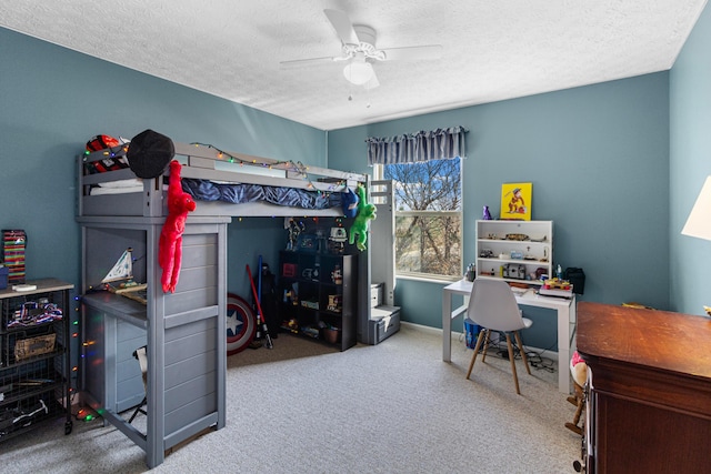 carpeted bedroom with a ceiling fan, baseboards, and a textured ceiling