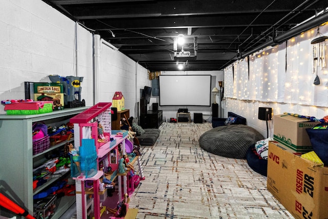 home theater room featuring concrete block wall