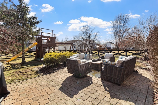 view of patio / terrace with an outdoor living space and a playground