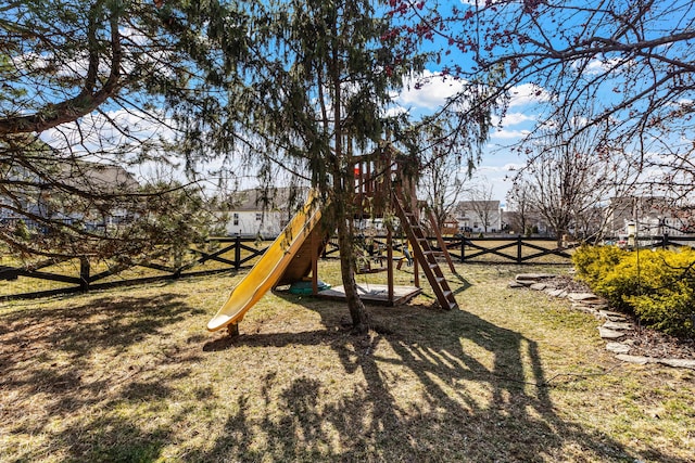 view of jungle gym with fence