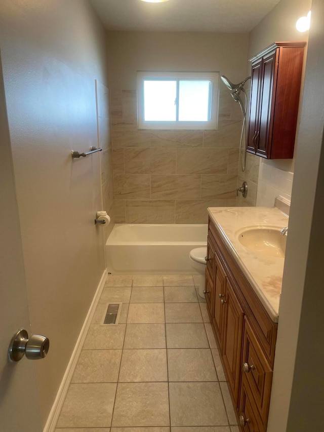 bathroom with tile patterned floors, visible vents, toilet,  shower combination, and vanity