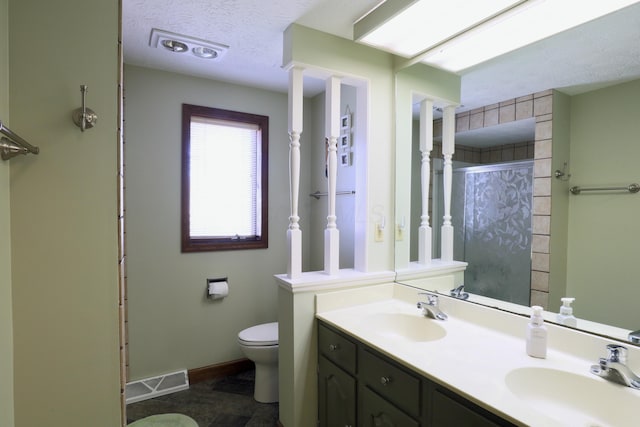 full bath with toilet, a shower, visible vents, and a sink