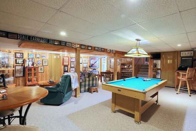 rec room with carpet, wood walls, and pool table