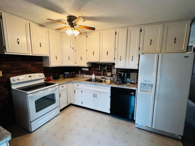 kitchen featuring a ceiling fan, a sink, a textured ceiling, white appliances, and white cabinets