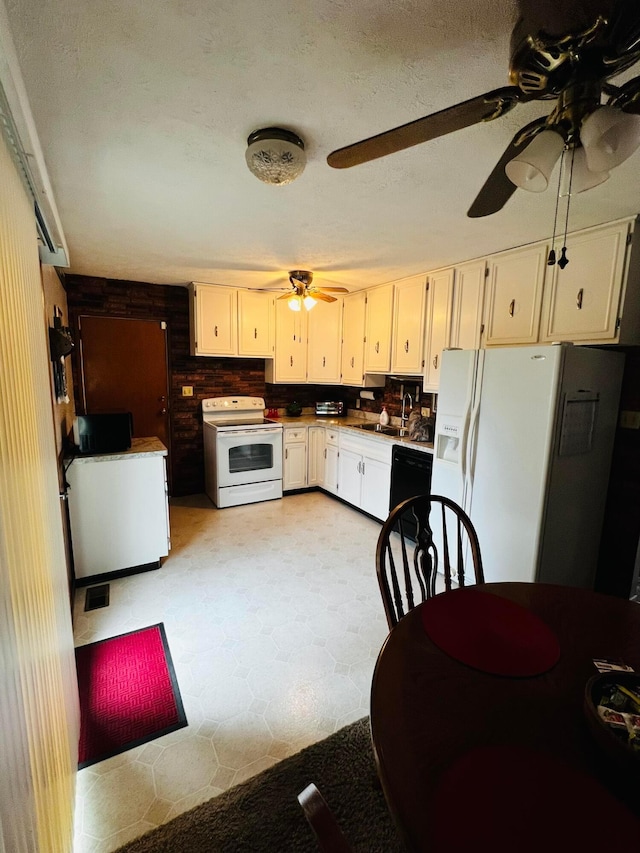 kitchen with black appliances, ceiling fan, white cabinets, a textured ceiling, and a sink