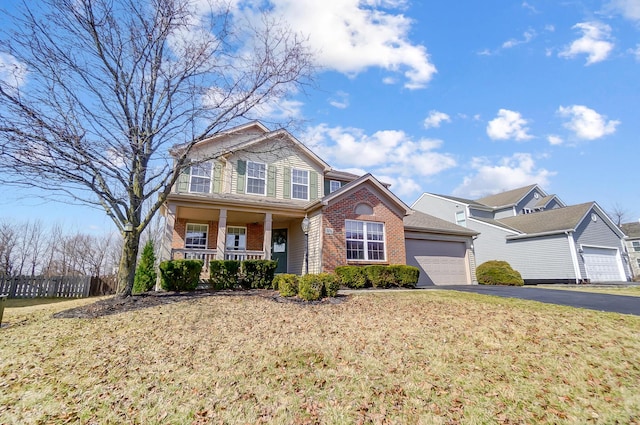 view of front of house featuring brick siding, fence, covered porch, a garage, and driveway