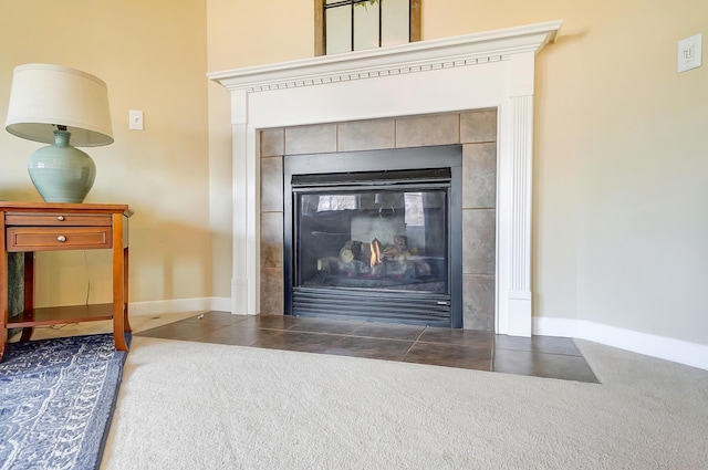 interior details with baseboards and a fireplace