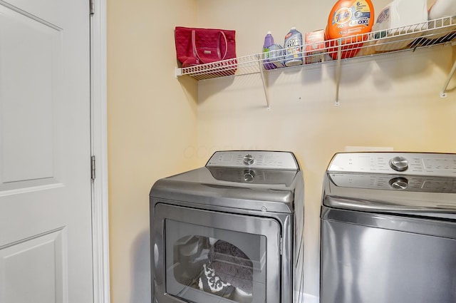 laundry area with washing machine and dryer and laundry area