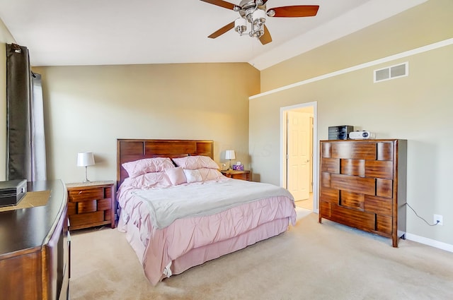 bedroom featuring visible vents, ceiling fan, baseboards, light colored carpet, and vaulted ceiling