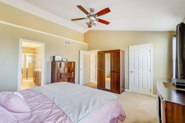 bedroom with visible vents, ensuite bath, lofted ceiling, light colored carpet, and ceiling fan