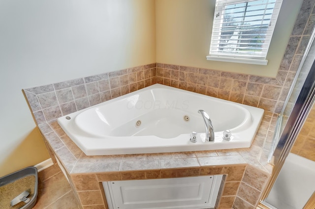 full bathroom with a stall shower and a whirlpool tub