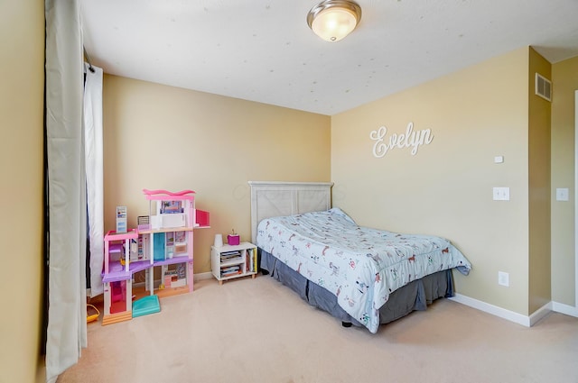 bedroom with visible vents, baseboards, and carpet floors