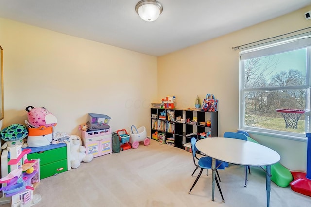 recreation room featuring carpet flooring