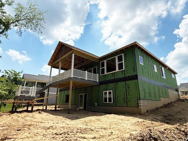 2010 Ridgebrook Rd, Lancaster, OH 43130 - rear view of property featuring board and batten siding and a deck