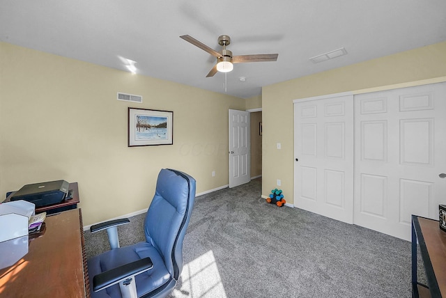 office featuring visible vents, carpet floors, baseboards, and ceiling fan