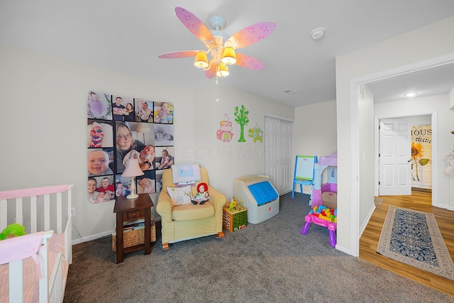 bedroom with a closet, baseboards, and ceiling fan