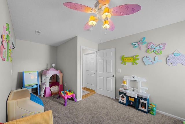 game room featuring visible vents, baseboards, carpet, and a ceiling fan