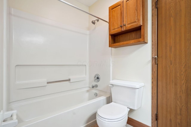 full bath featuring tub / shower combination, baseboards, and toilet