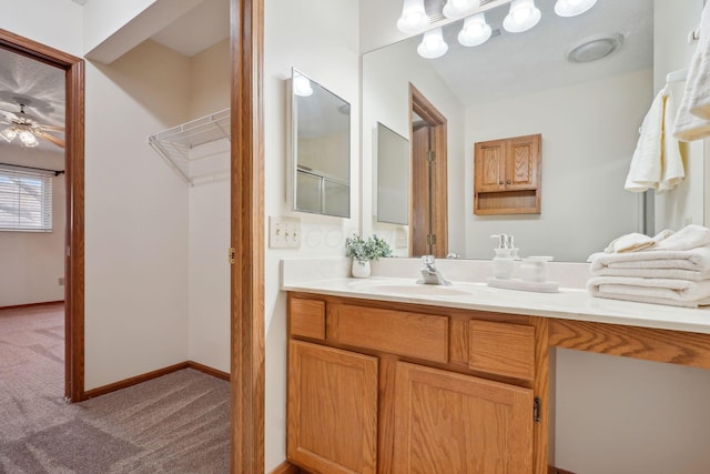 bathroom featuring baseboards and vanity