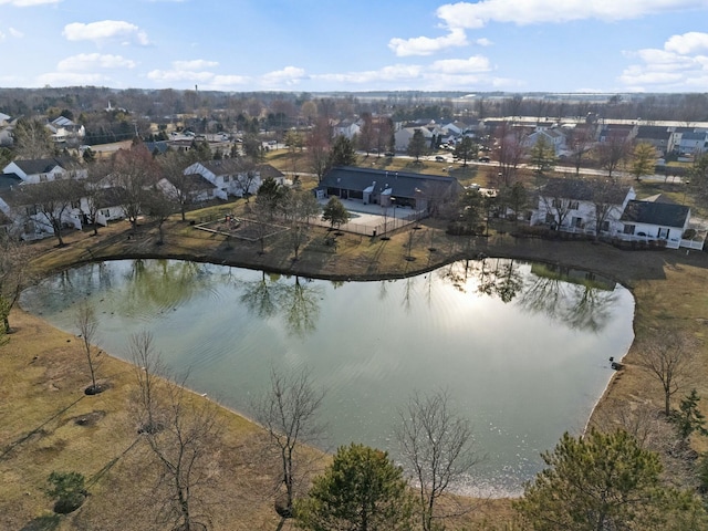 drone / aerial view featuring a residential view and a water view