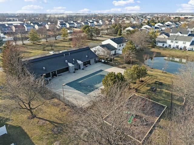 drone / aerial view featuring a residential view and a water view