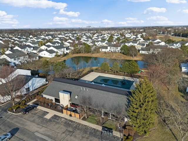 birds eye view of property with a residential view and a water view