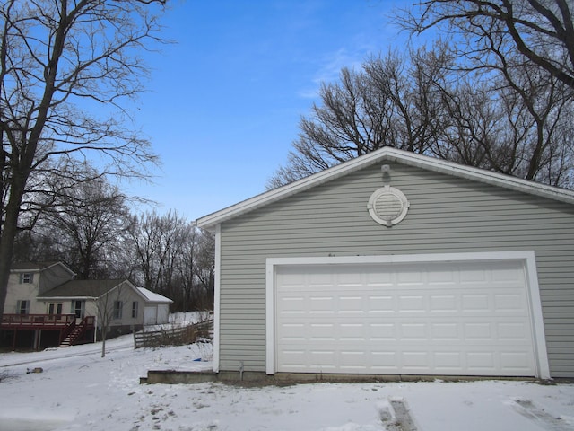 view of snow covered garage