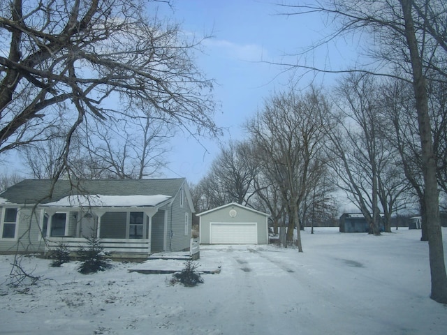 view of front of home with an outbuilding and a garage