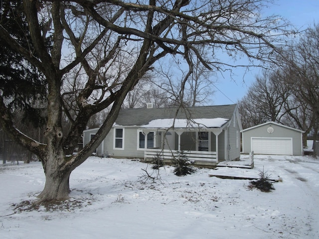 view of front of property with an outbuilding and a detached garage