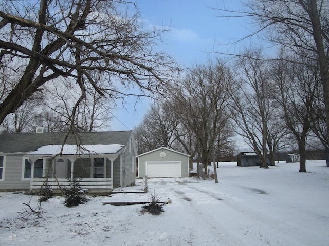 view of front of house featuring an outdoor structure and a garage