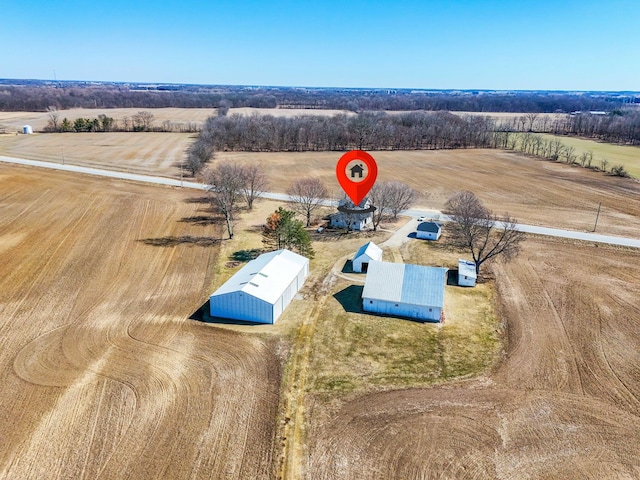 birds eye view of property featuring a rural view