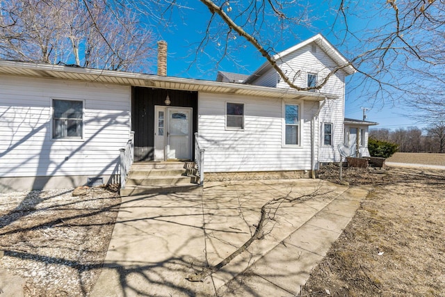 view of front of home with a chimney