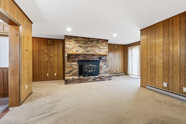 unfurnished living room with recessed lighting, wood walls, baseboard heating, and carpet floors