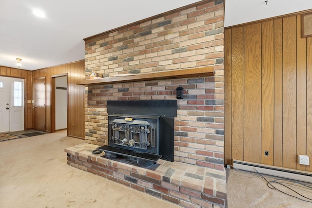 details with a baseboard heating unit, carpet, and wooden walls